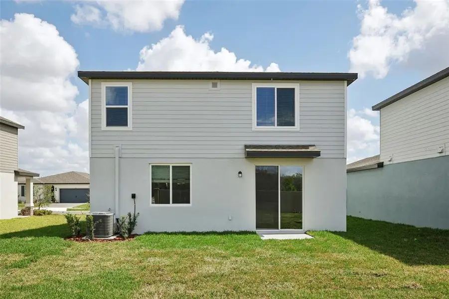 Exterior details and patio area of a home in Two Rivers - Premier Series, Zephyrhills (Image 2). Exterior details and patio area of a home in Two Rivers - Premier Series, Zephyrhills (Image 2).