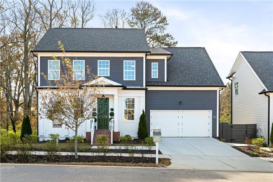 Front exterior of a new home in Harmony, Auburn, GA, highlighting curb appeal (Image 1).
