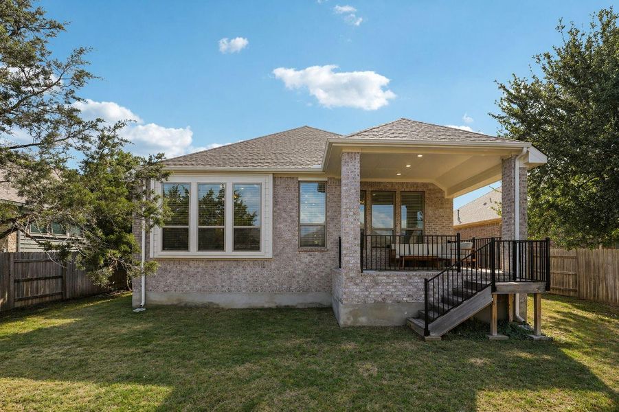 A private backyard oasis with a covered patio, perfect for outdoor living and entertaining.