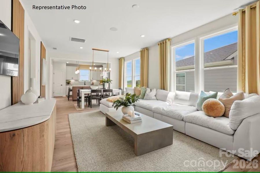 Bright and open-concept living, dining, and kitchen spaces