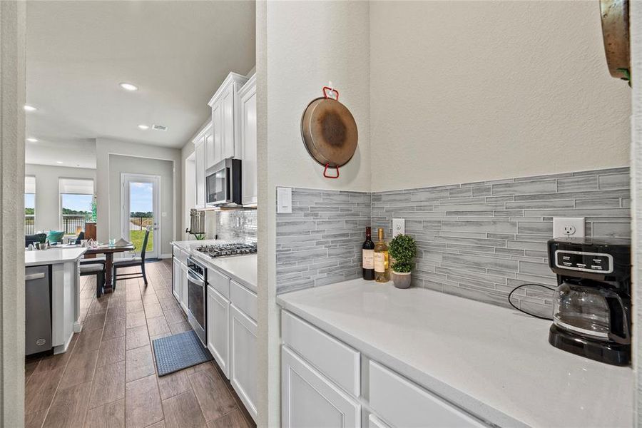 Entertain with ease! Your very own Butler's Pantry, conveniently nestled between the Kitchen and Dining room, adds a touch of elegance to your hosting experience.