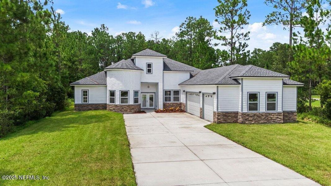 Front exterior of a new home in , Jacksonville, FL, highlighting curb appeal (Image 1).