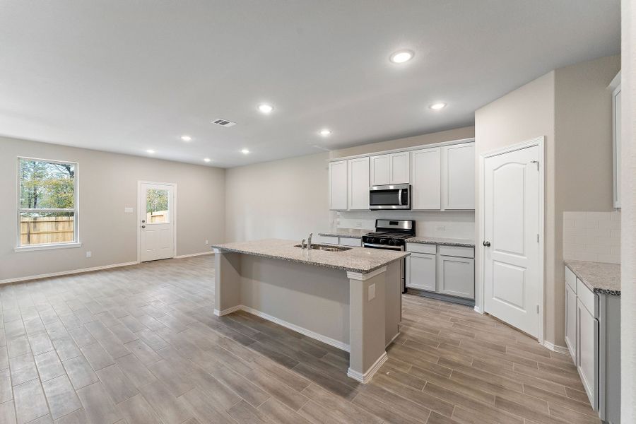 A kitchen with white cabinets. A kitchen with white cabinets.
