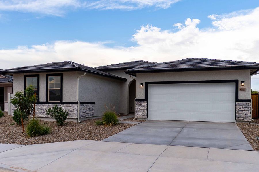 Front exterior of a new home in Rancho Mirage, Maricopa, AZ, highlighting curb appeal (Image 22). Front exterior of a new home in Rancho Mirage, Maricopa, AZ, highlighting curb appeal (Image 22).