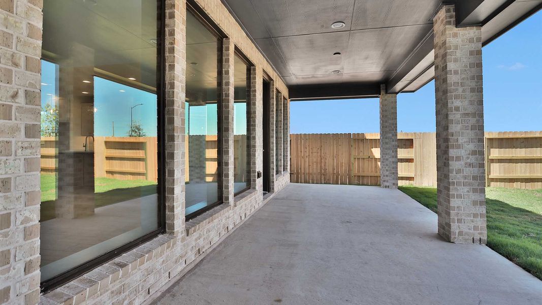 Exterior details and patio area of a home in Lakes of Cane Island, Katy (Image 3).