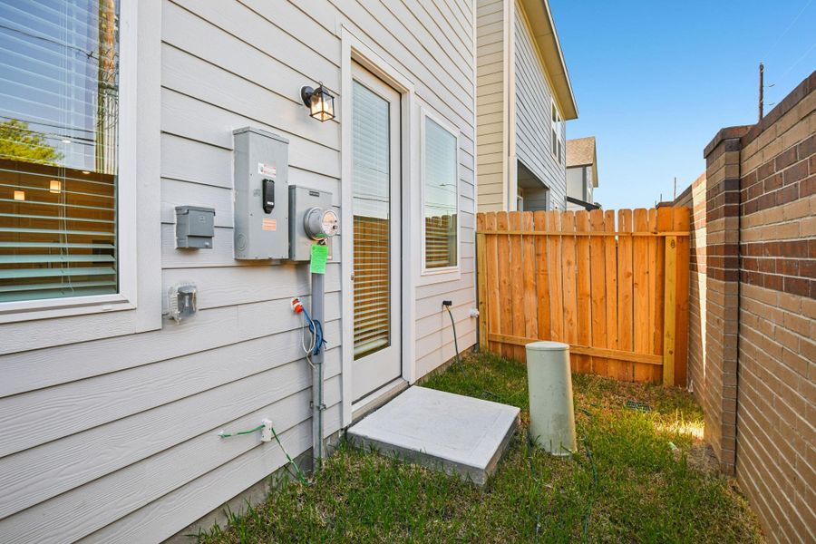 Exterior details and patio area of a home in Spring Brook Village - City Series, Houston (Image 24). Exterior details and patio area of a home in Spring Brook Village - City Series, Houston (Image 24).