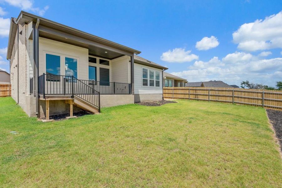 Front exterior of a new home in Park Collection at Heritage, Dripping Springs, TX, highlighting curb appeal (Image 2). Front exterior of a new home in Park Collection at Heritage, Dripping Springs, TX, highlighting curb appeal (Image 2).
