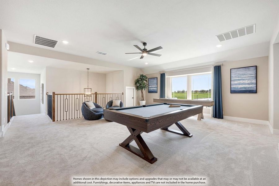 Upstairs bonus room with pool table, carpet flooring, ceiling fan, and large windows overlooking green fields