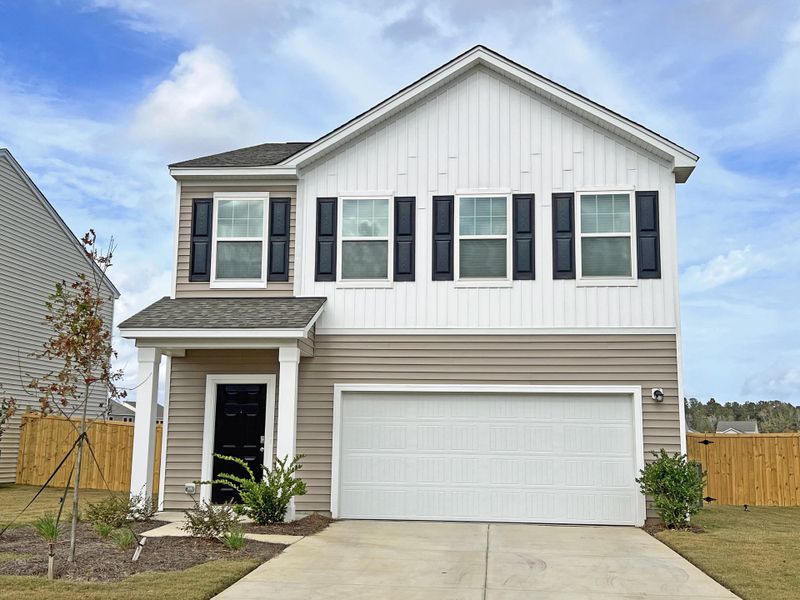 Front exterior of a new home in Watson Hill, Summerville, SC, highlighting curb appeal (Image 1). Front exterior of a new home in Watson Hill, Summerville, SC, highlighting curb appeal (Image 1).