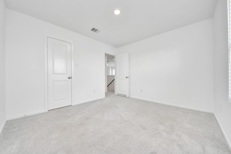Another generously sized bedroom.