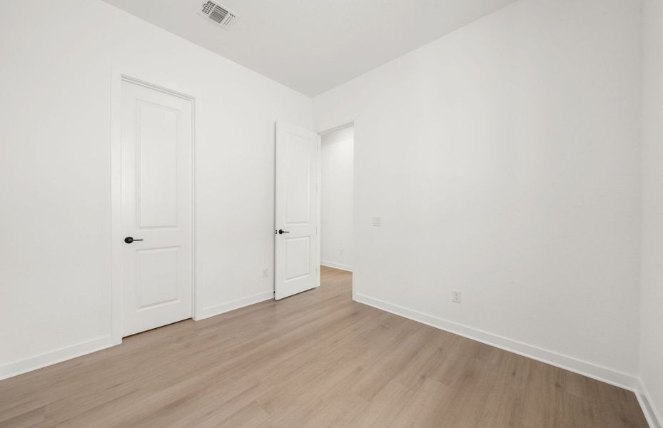 Representative unfurnished interior of a home built from the Dobbin by Pulte Homes in 6 Creeks, Kyle (Image 44).