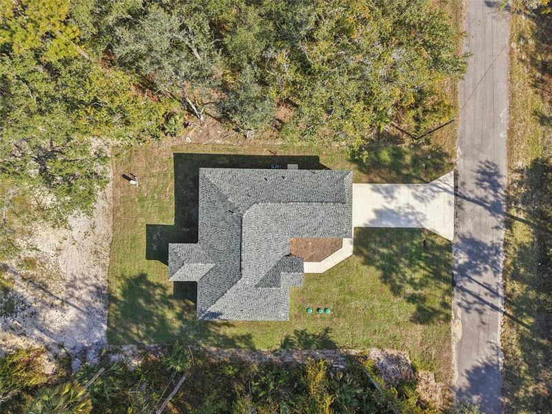 Front exterior of a new home in , Ocklawaha, FL, highlighting curb appeal (Image 1).