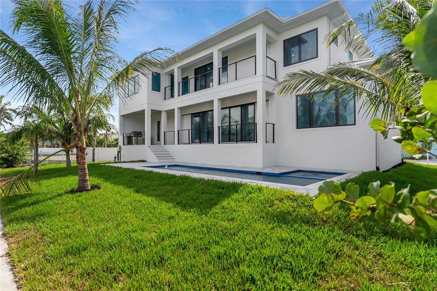 Front exterior of a new home in , Longboat Key, FL, highlighting curb appeal (Image 31). Front exterior of a new home in , Longboat Key, FL, highlighting curb appeal (Image 31).