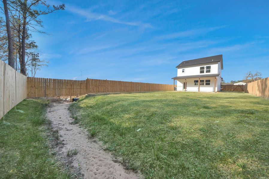 Exterior details and patio area of a home in , Conroe (Image 24).