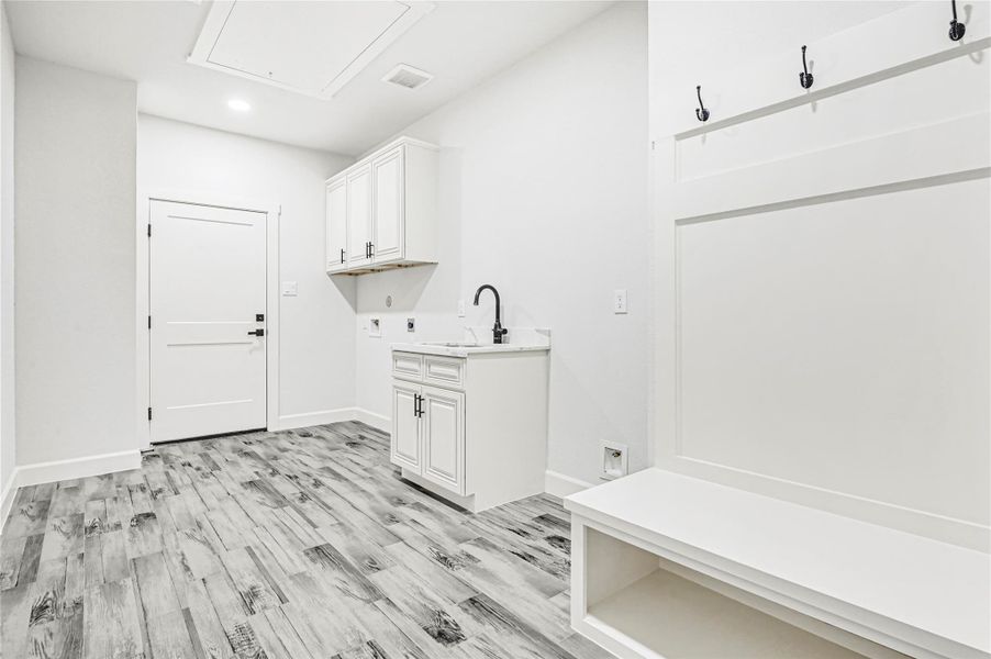 Laundry room with sink and tons of room Laundry room with sink and tons of room