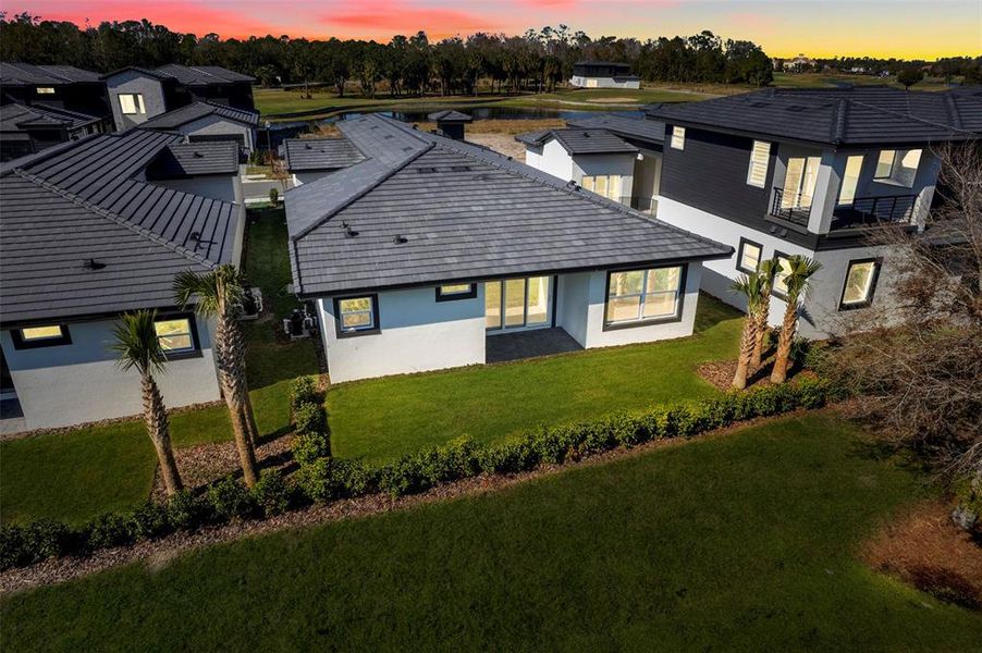 Front exterior of a new home in Hampton Green at Providence, Davenport, FL, highlighting curb appeal (Image 2).