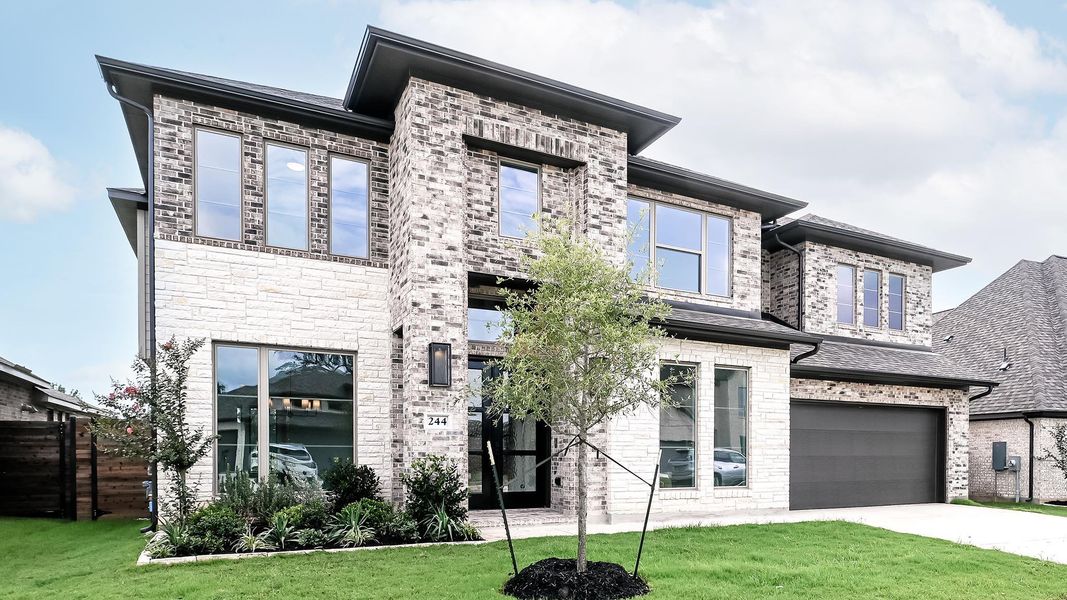 Front exterior of a new home in Juniper Springs, Lockhart, TX, highlighting curb appeal (Image 18). Front exterior of a new home in Juniper Springs, Lockhart, TX, highlighting curb appeal (Image 18).