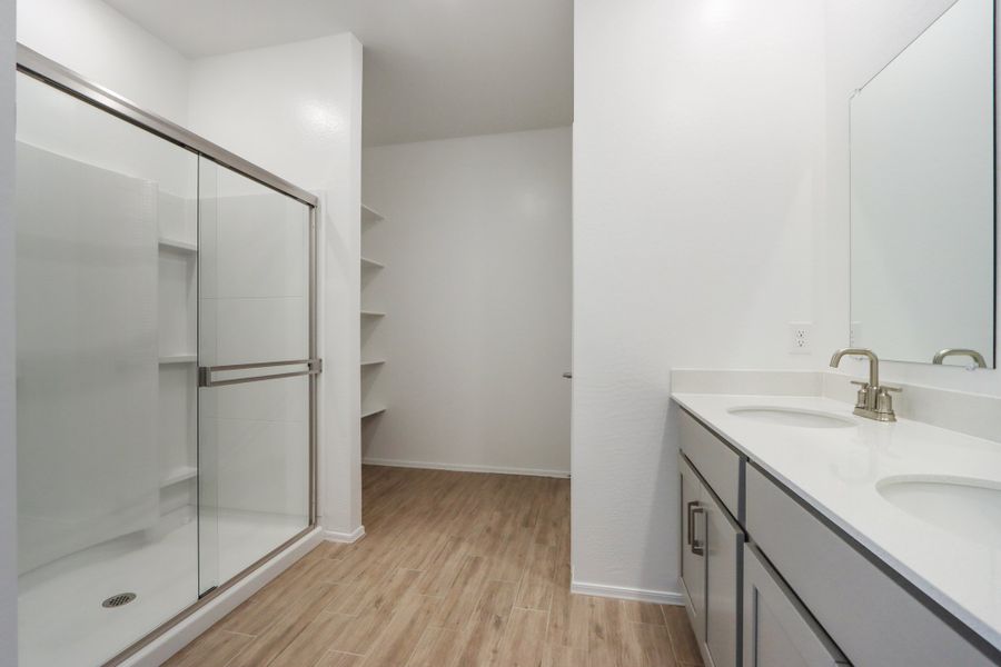 Primary bath. Finishes and options may vary by community.