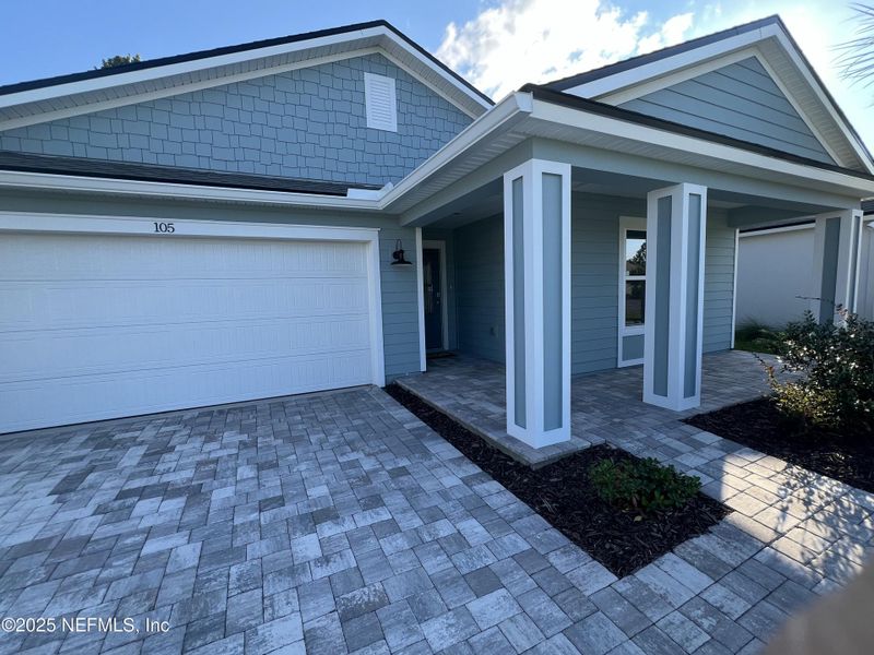 Exterior details and patio area of a home in American Village, Palm Coast (Image 3).