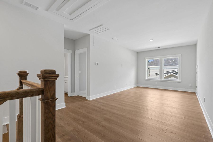 Spacious, unfurnished interior of a new home in Hidden Ponds Reserve, Awendaw (Image 41).