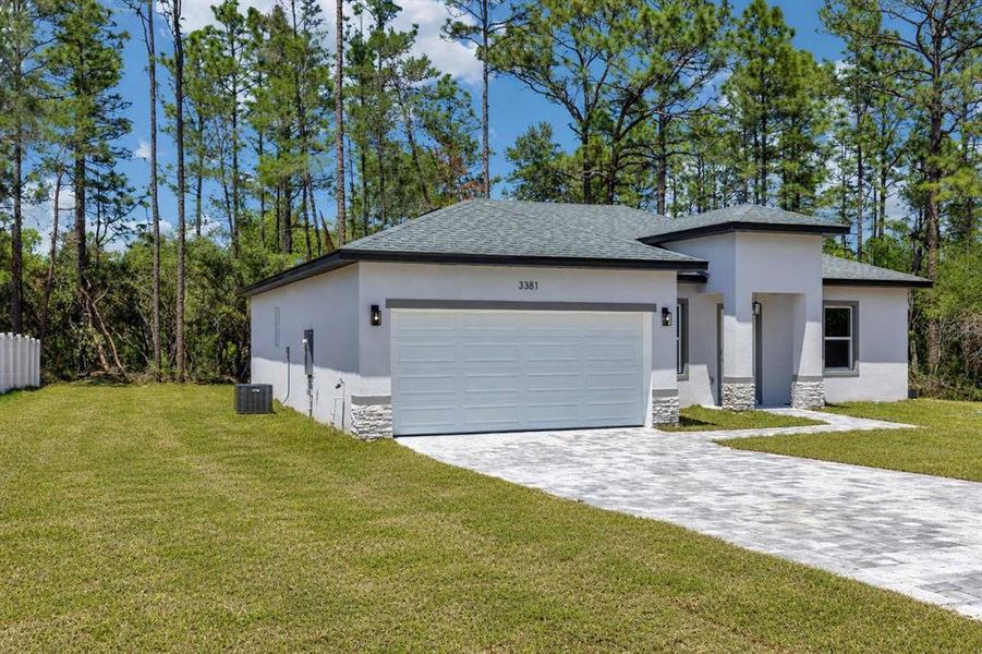 Front exterior of a new home in , Citrus Springs, FL, highlighting curb appeal (Image 20). Front exterior of a new home in , Citrus Springs, FL, highlighting curb appeal (Image 20).