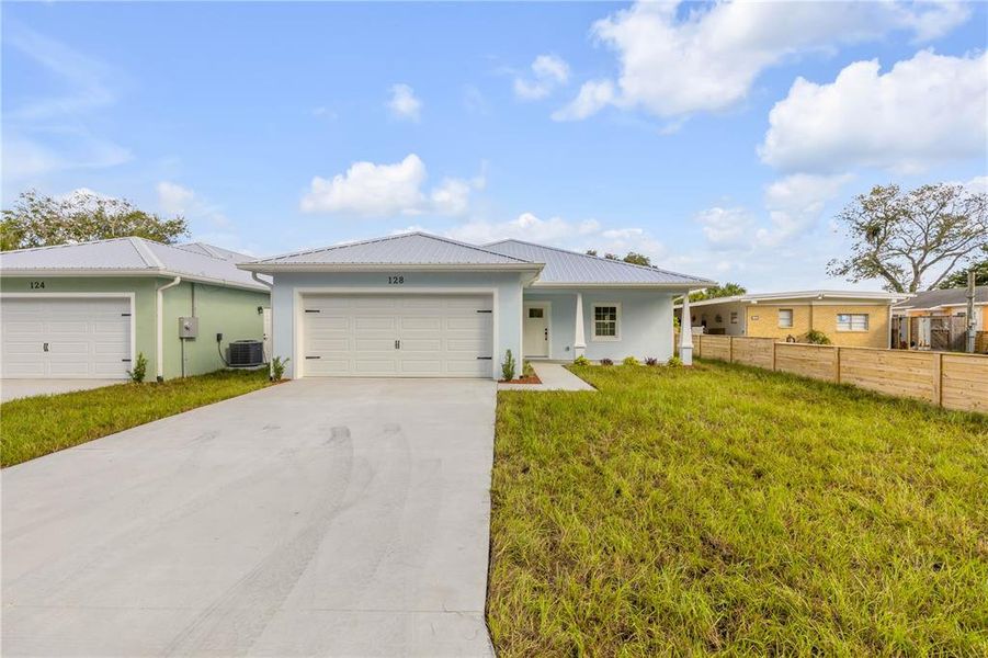 Front exterior of a new home in , Oak Hill, FL, highlighting curb appeal (Image 27).