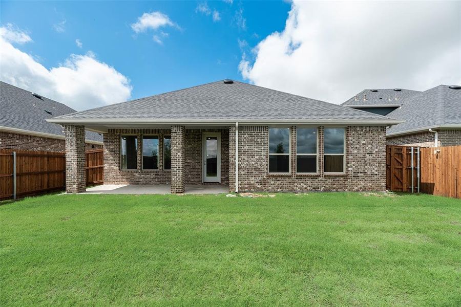 Front exterior of a new home in Sutton Fields, Celina, TX, highlighting curb appeal (Image 17).