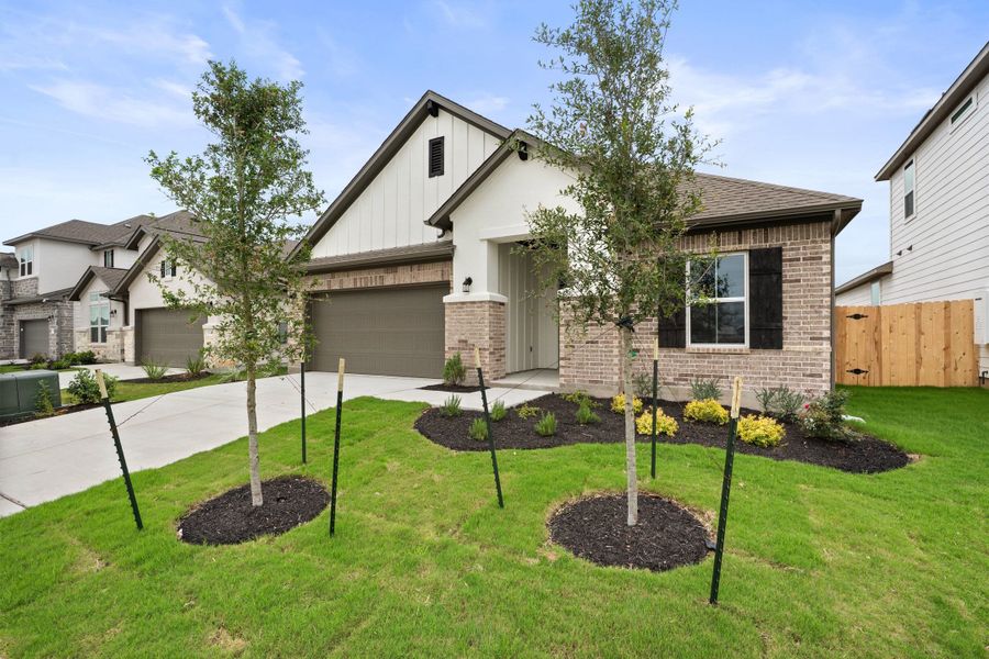 Front exterior of a new home in Lagos Reserve, Manor, TX, highlighting curb appeal (Image 25).