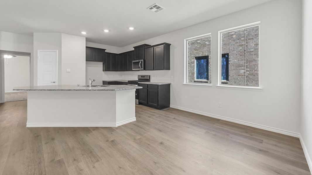 Representative furnished interior of a home built from the Chester by D.R. Horton in Bel Air Village, Sherman (Image 5).