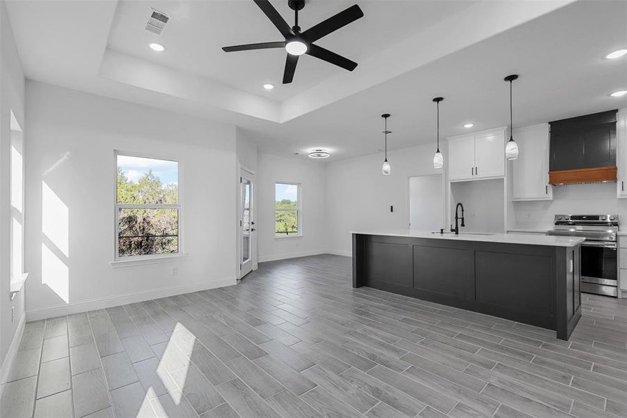 Open kitchen and living room with fireplace