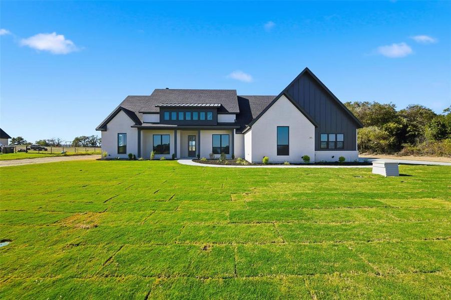 Front exterior of a new home in , Poolville, TX, highlighting curb appeal (Image 24).