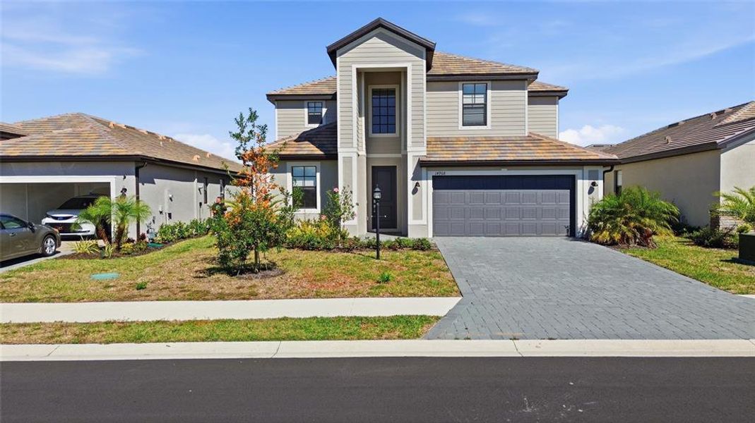 Front exterior of a new home in , Bradenton, FL, highlighting curb appeal (Image 24).