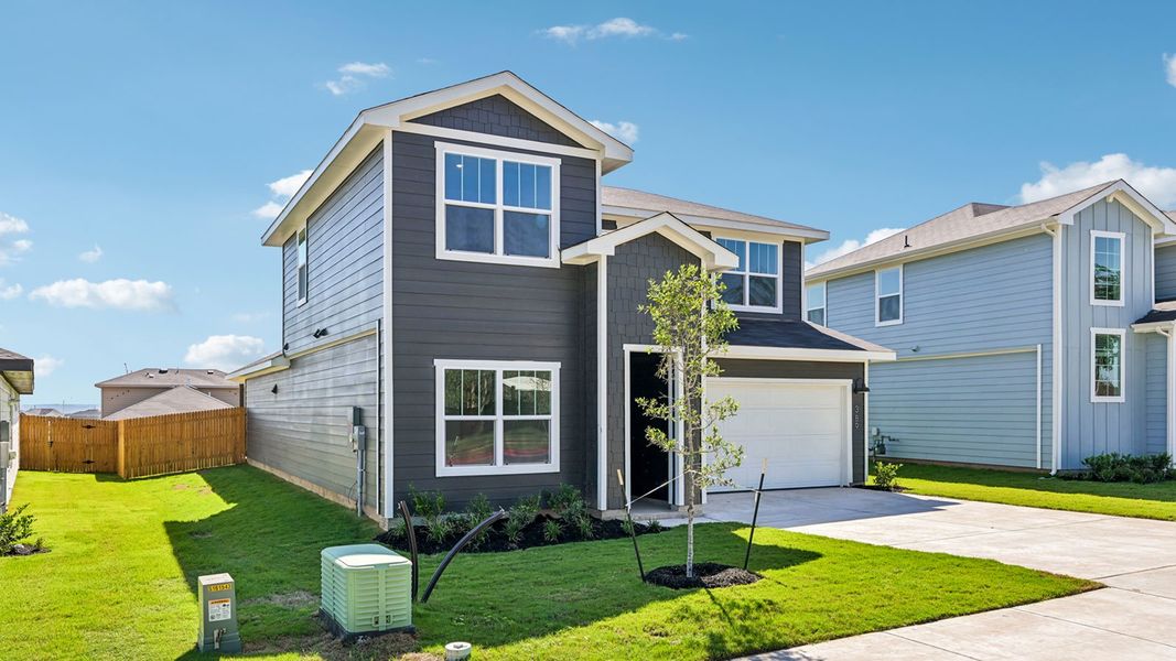 Front exterior of a new home in Valverde, Bastrop, TX, highlighting curb appeal (Image 2).