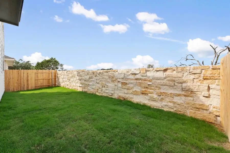 Exterior details and patio area of a home in Lariat, Liberty Hill (Image 3).