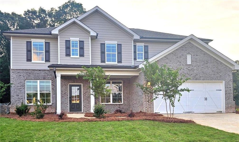 Front exterior of a new home in Ellorie Estates, Dawsonville, GA, highlighting curb appeal (Image 1). Front exterior of a new home in Ellorie Estates, Dawsonville, GA, highlighting curb appeal (Image 1).