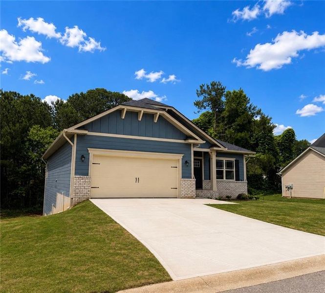 Front exterior of a new home in Magnolia Villas, Cornelia, GA, highlighting curb appeal (Image 17).