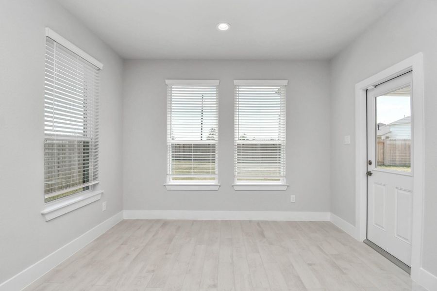 Enjoy breakfast with ease in the connected and cozy breakfast area, seamlessly integrated with the kitchen for utmost convenience. Step through the back door for a breath of fresh air onto the covered patio, extending your living space to the outdoors. Sample photo of completed home with similar floor plan. Actual colors and selections may vary. Enjoy breakfast with ease in the connected and cozy breakfast area, seamlessly integrated with the kitchen for utmost convenience. Step through the back door for a breath of fresh air onto the covered patio, extending your living space to the outdoors. Sample photo of completed home with similar floor plan. Actual colors and selections may vary.