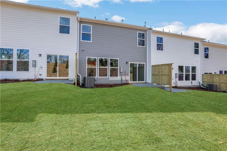Exterior details and patio area of a home in Villas at Dawsonville Townhomes, Dawsonville (Image 17).