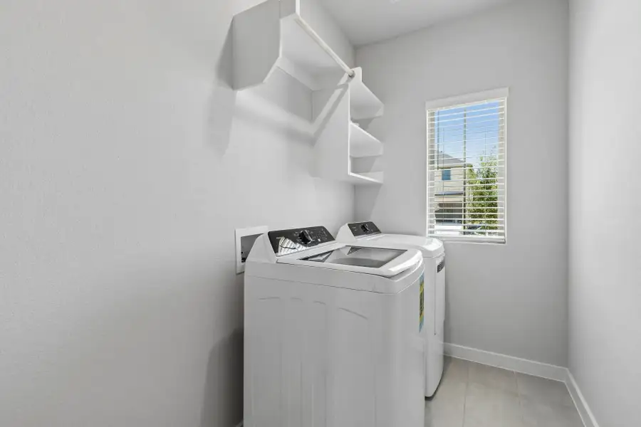 Utility Room in the Cypress home plan by Trophy Signature Homes - REPRESENTATIVE PHOTO