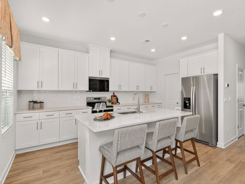 Turn the kitchen island into a bar counter for extra seating.