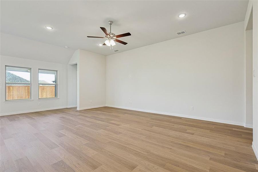 Empty room featuring light hardwood / wood-style floors and ceiling fan