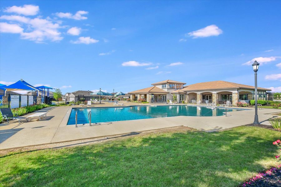 Community pool with a yard, a patio, and fence