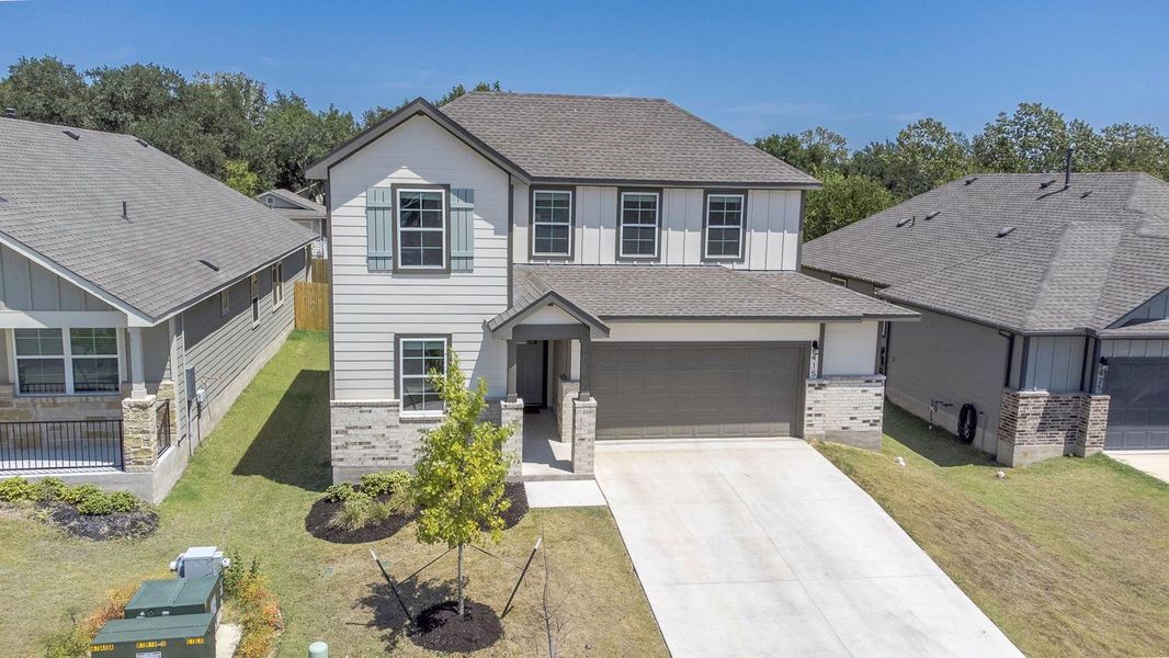 Front exterior of a new home in Brooks Ranch, Kyle, TX, highlighting curb appeal (Image 24).