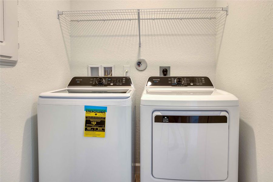 The laundry comes with a full-sized pair and is located near the bedrooms for convenience.