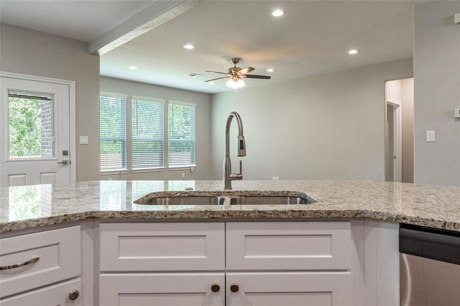 Sink at peninsula overlooking family room