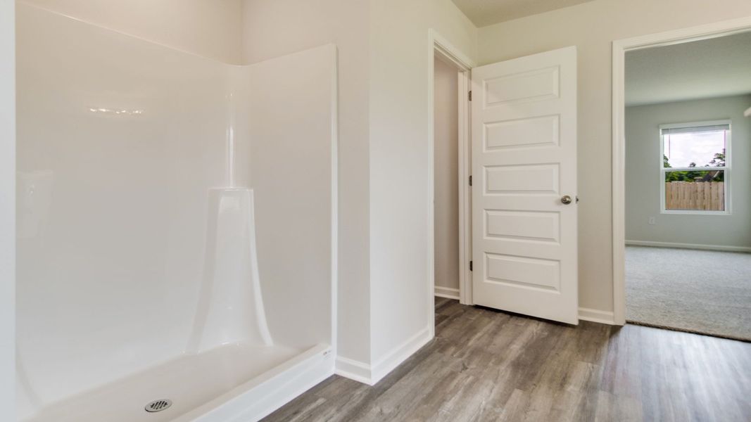 Spacious, unfurnished interior of a new home in The Enclave at Bar W Ranch, Baker (Image 23).