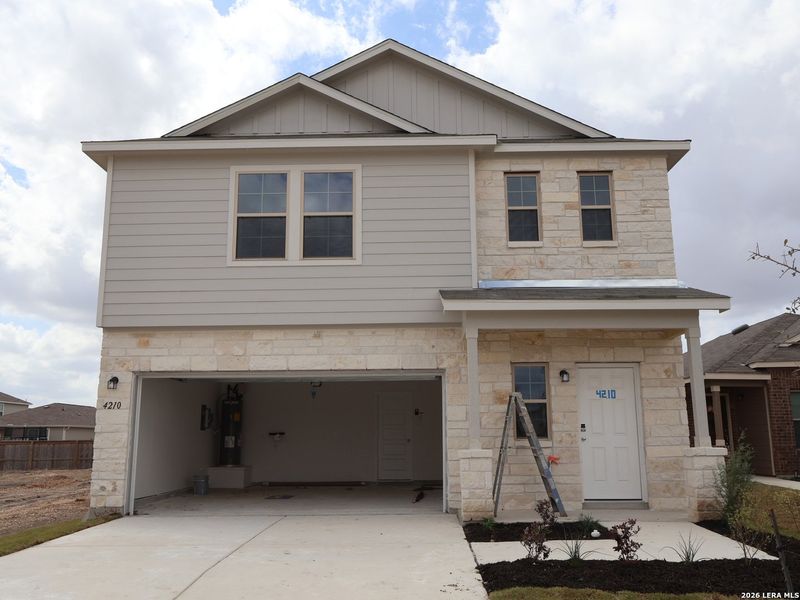 Front exterior of a new home in Park Place, New Braunfels, TX, highlighting curb appeal (Image 20). Front exterior of a new home in Park Place, New Braunfels, TX, highlighting curb appeal (Image 20).
