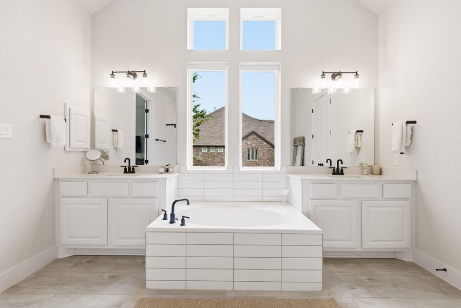 Sink into the soaking tub after a long day, positioned perfectly to help you relax, decompress, and wash the afternoon stress away