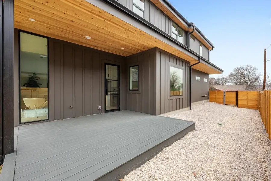 Wooden deck featuring a fenced backyard