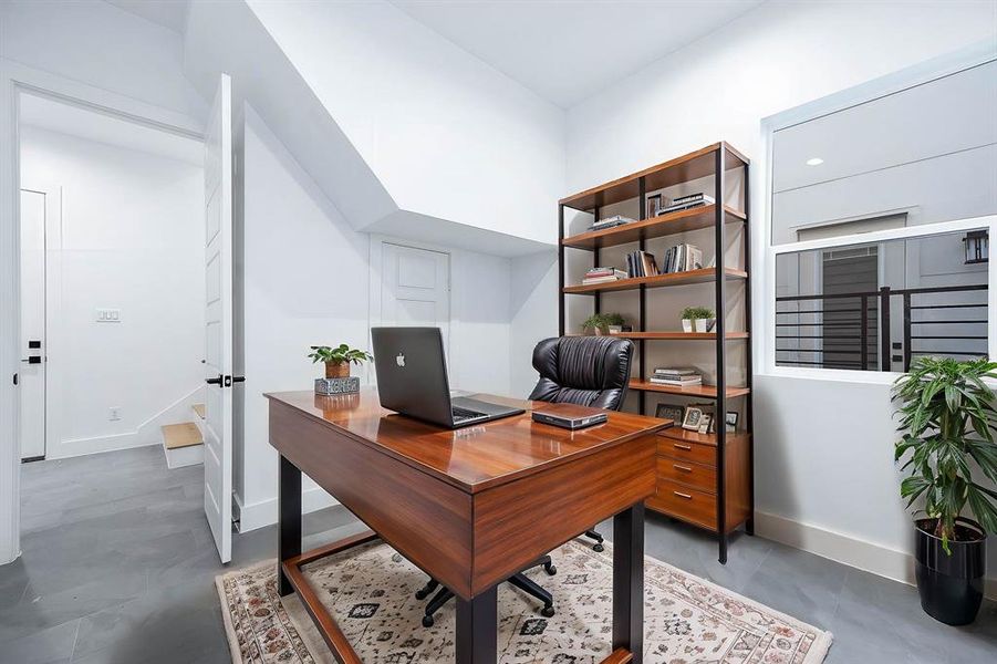 This room is large enough for a guesst room or a dedicated office space. This photo has been virtually staged.